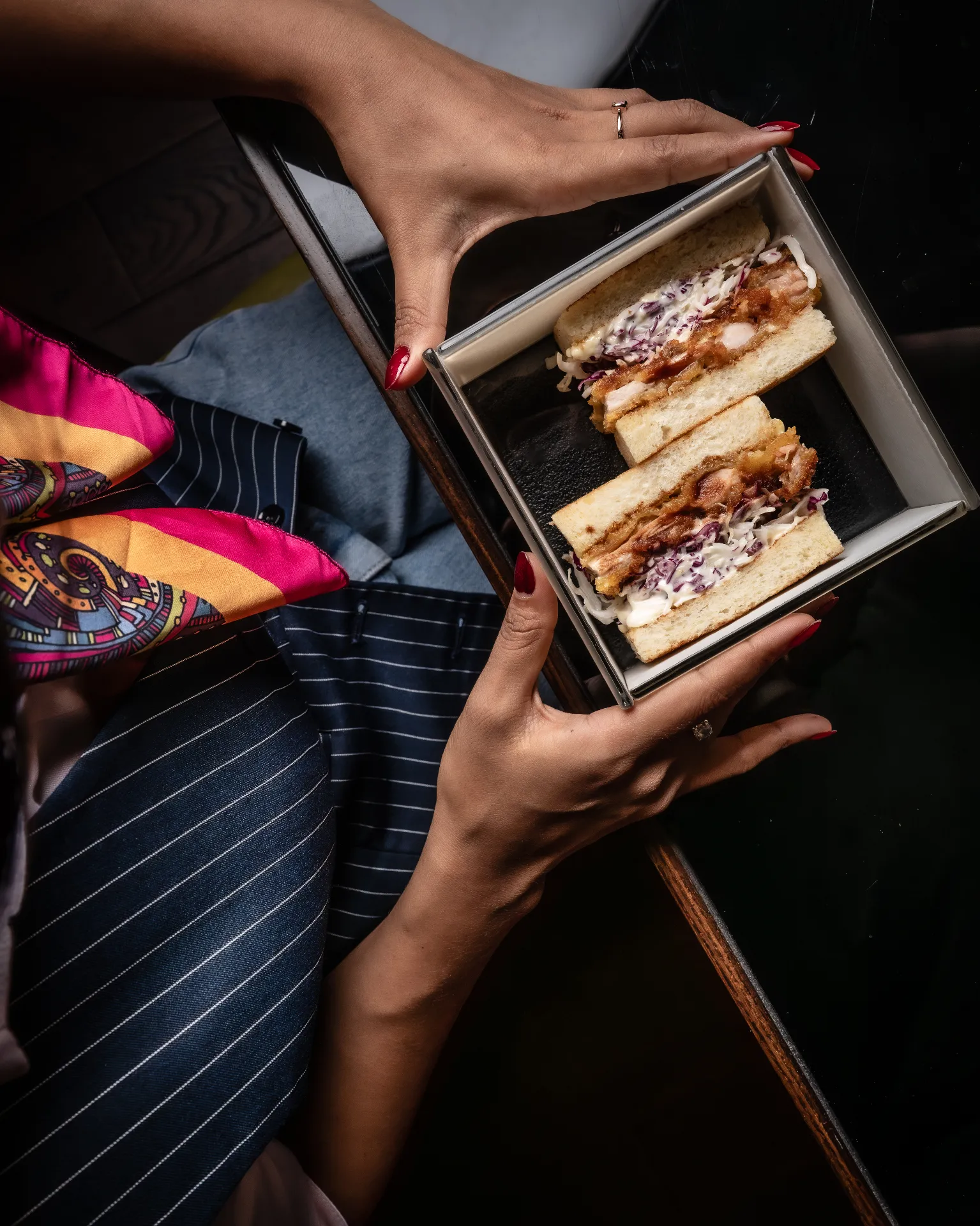 Katsu sando sandwich served in a metal box
